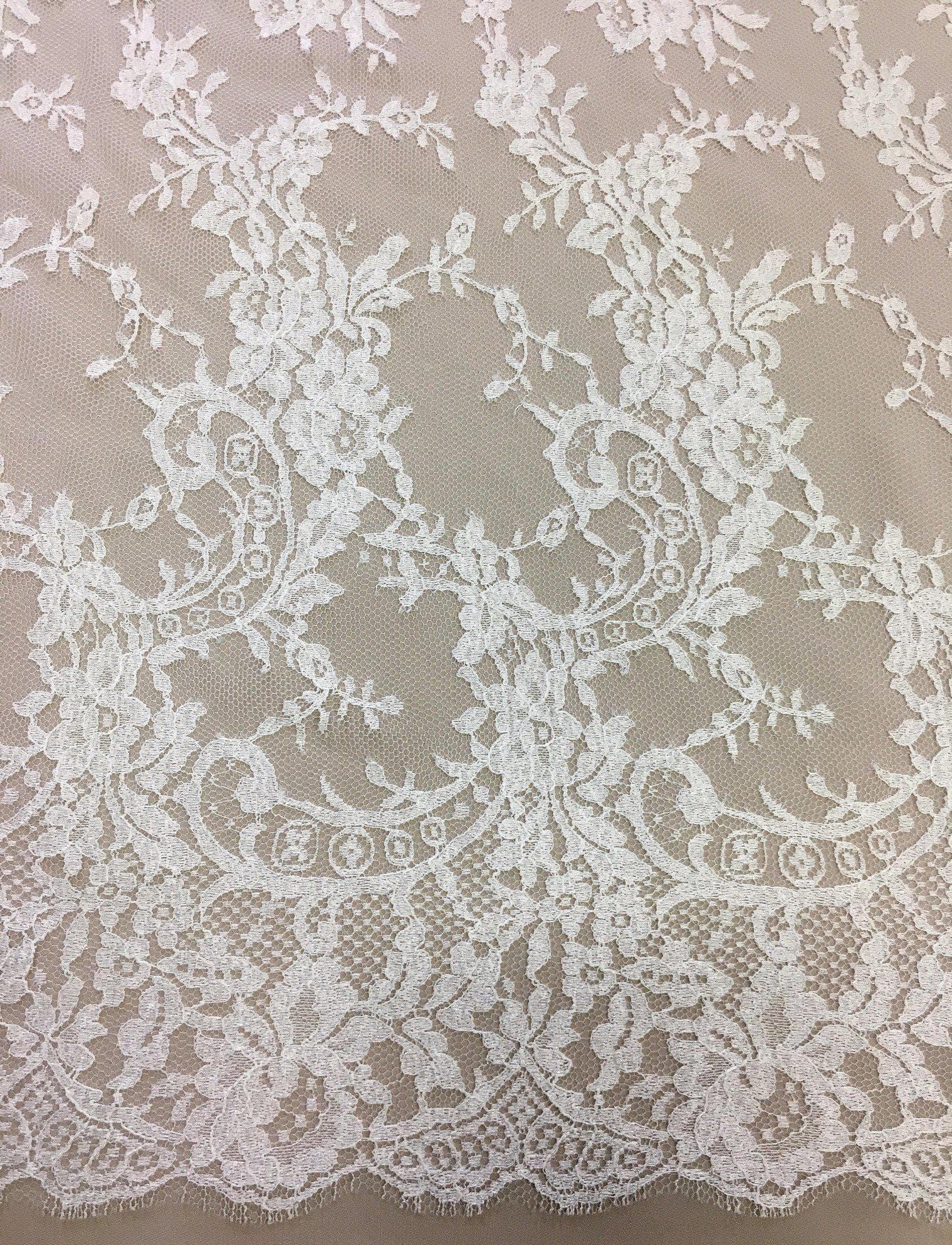 Ivory Fine Chantilly lace — featuring scalloped edges, eyelash detail and floral motifs, in viscose, 135cm wide