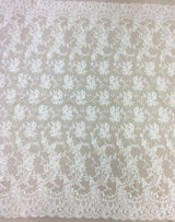 Ivory Fine Chantilly lace — featuring scalloped edges, eyelash detail and floral motifs, in viscose, 135cm wide