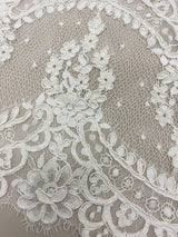 Ivory Corded Abloom lace trim — featuring scalloped edges, floral motifs and a corded texture, in nylon and viscose, 30cm wide
