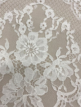 Ivory Fine Floral Lace — featuring scalloped edges and floral motifs, in cotton and nylon, 140cm wide