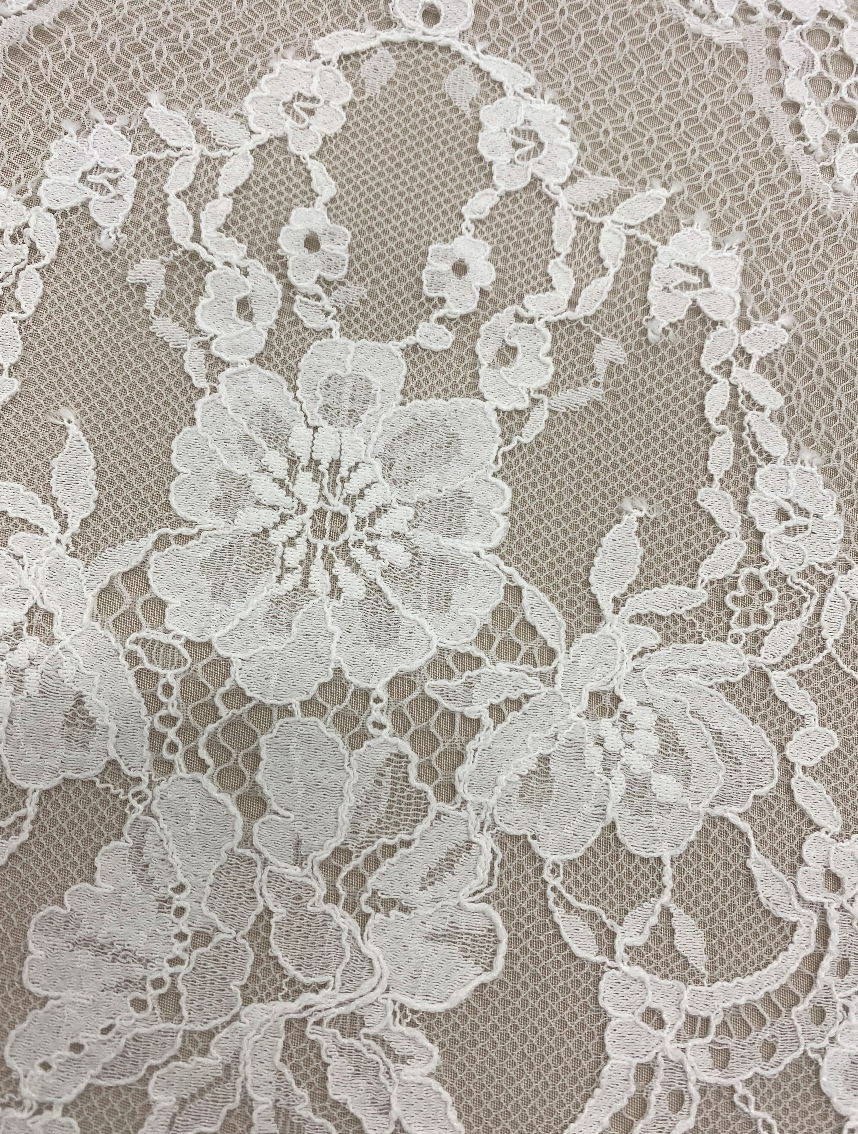 Ivory Fine Floral Lace — featuring scalloped edges and floral motifs, in cotton and nylon, 140cm wide