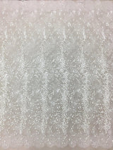 Ivory Embroidered Lace — featuring scalloped edges, eyelash detail and floral motifs, in nylon and viscose, 130cm wide