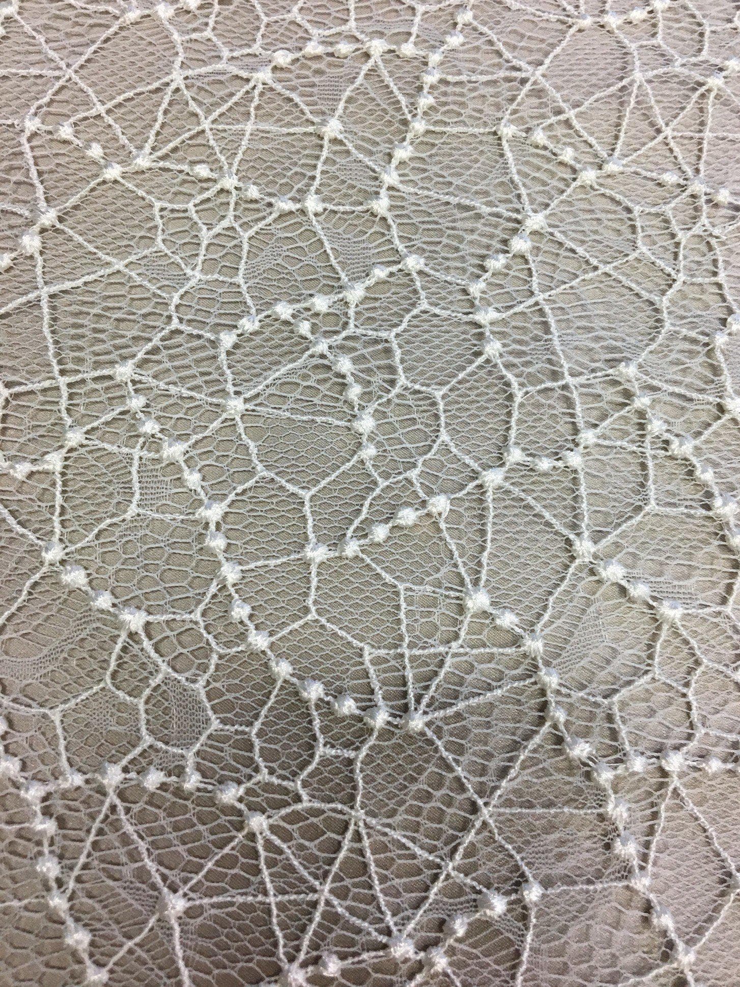 Ivory Abstract Fine Lace — featuring scalloped edges and an abstract web-like design, in nylon, 95cm wide