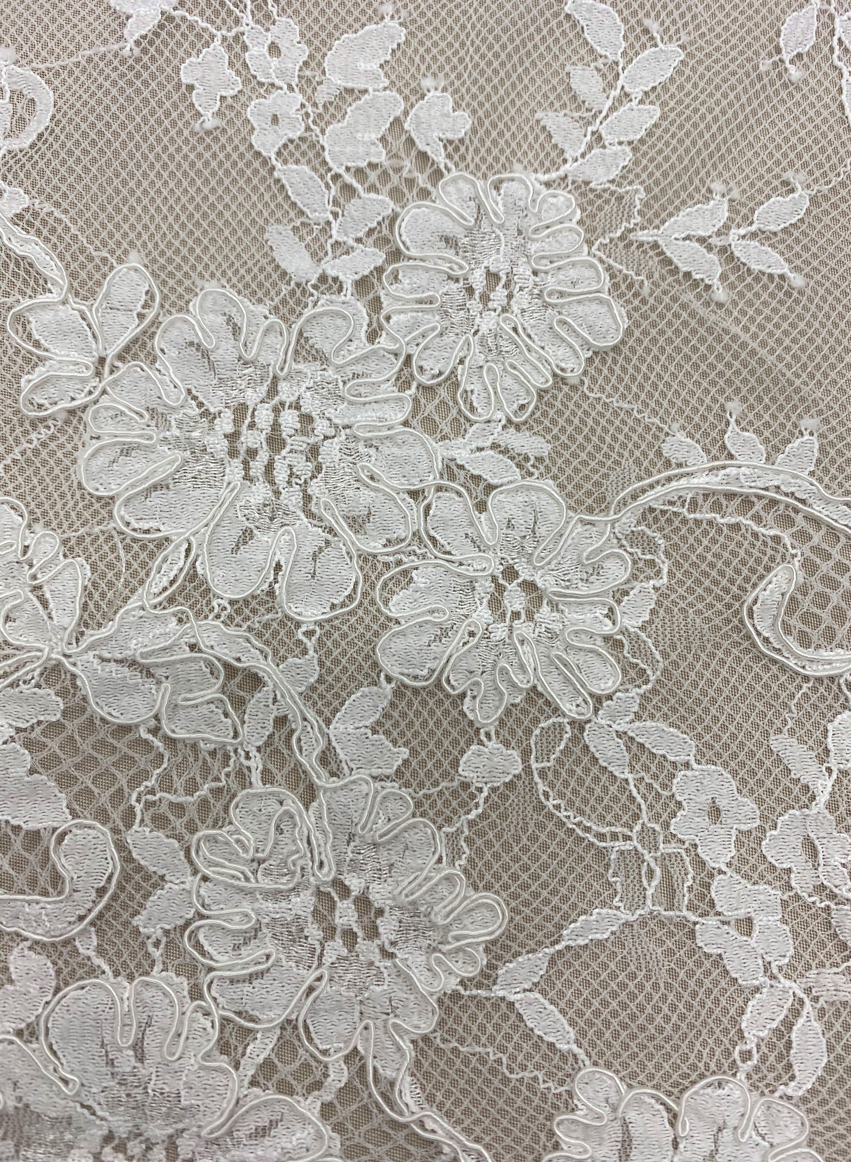 Ivory Corded Floral Lace — featuring scalloped edges, eyelash detail and floral motifs, 140cm wide
