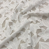 Ivory Floral Lace — featuring floral motifs and geometric motifs, 100cm wide