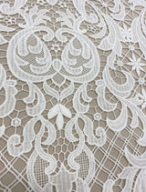 Ivory Filigree Guipure Lace — featuring scalloped edges, filigree scrollwork and paisley motifs, 120cm wide