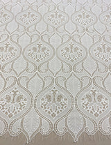 Ivory Embroidered Cutwork — featuring scalloped edges, eyelash detail and Guipure motifs, 100% polyester, 120cm wide