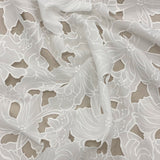 Ivory Embroidered Cutwork — featuring a floral cutwork design, 100% polyester, 130cm wide