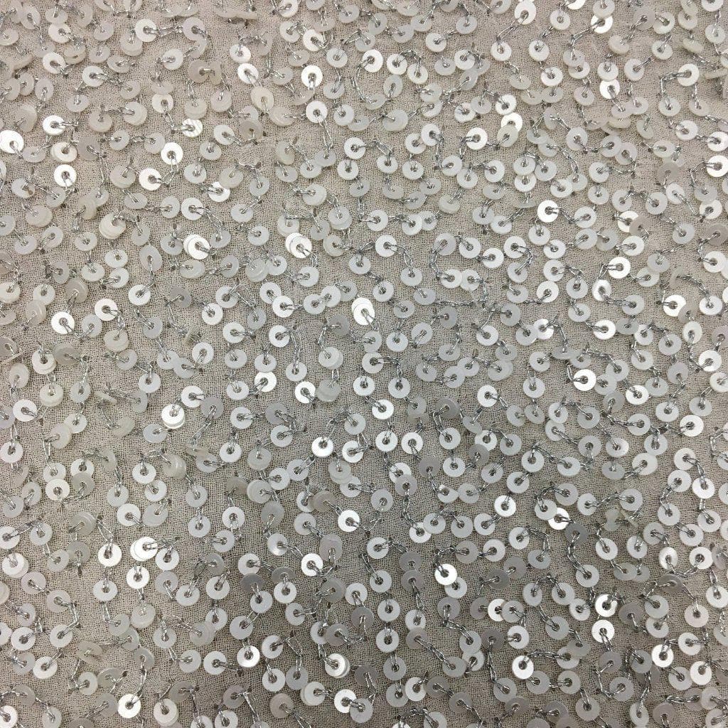 Platinum Sequin Georgette — heavily sequined on a 100% silk georgette base, with sequins running the length, 110cm wide