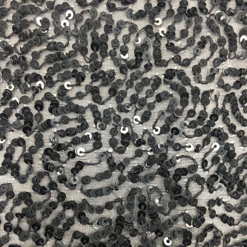 Black Sequin Georgette — heavily sequined on a 100% silk georgette base, with sequins running the length, 110cm wide