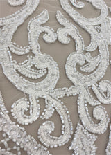 Ivory Embroidered Tulle — featuring scalloped edges and hand-beading, 50% nylon 50% rayon, 135cm wide