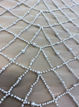Ivory Embellished Tulle — featuring hand-beading, 100% polyester, 140cm wide