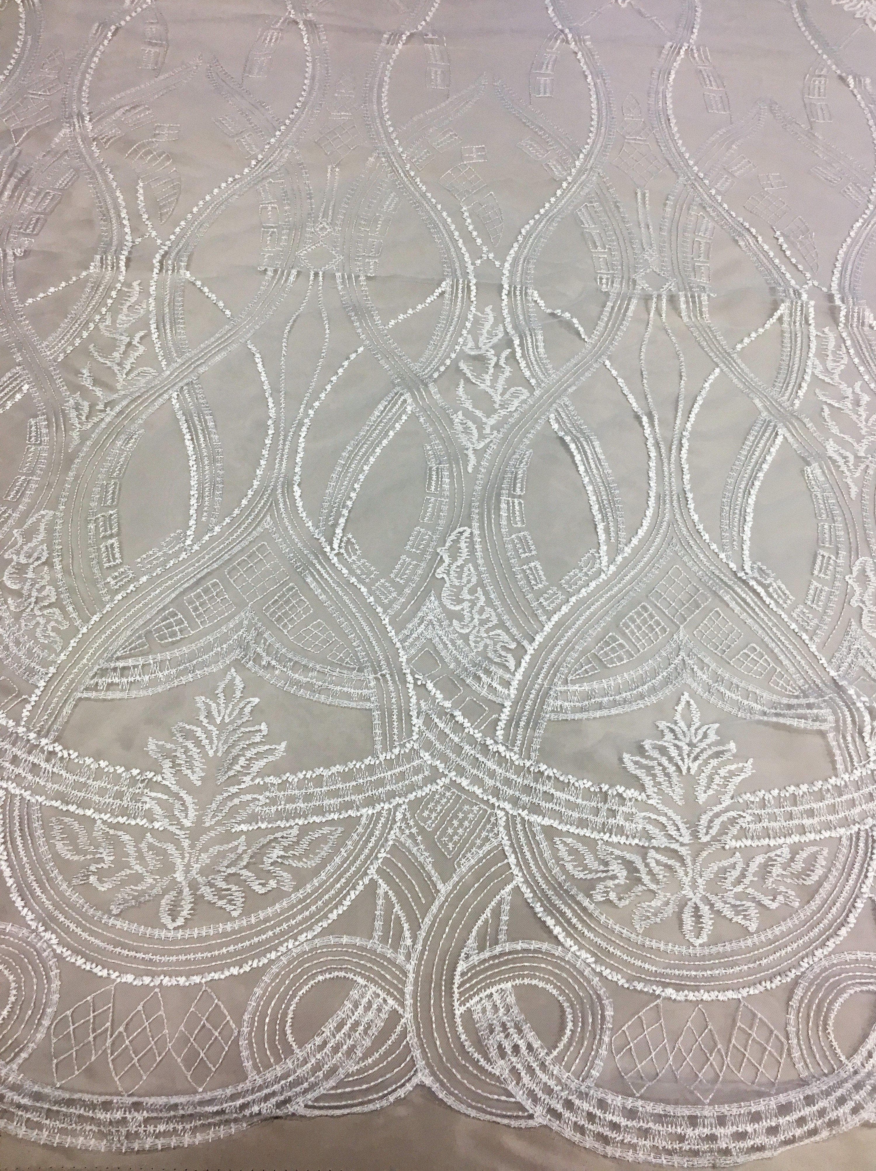 Ivory Embroidered Tulle — featuring scalloped edges, 50% nylon 50% rayon, 130cm wide