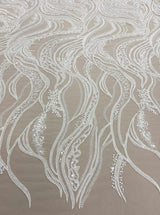 Ivory Embroidered Tulle — featuring scalloped edges, hand-beading and sequins, 50% nylon 50% rayon, 130cm wide