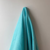 Turquoise Linen — mid-weight plain-weave linen with a slightly crisp handle that softens with wear, 100% linen, 135cm wide