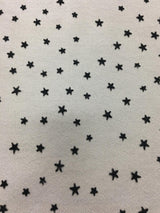 Black Star Tulle — featuring a flocked star design, 100% nylon, 150cm wide