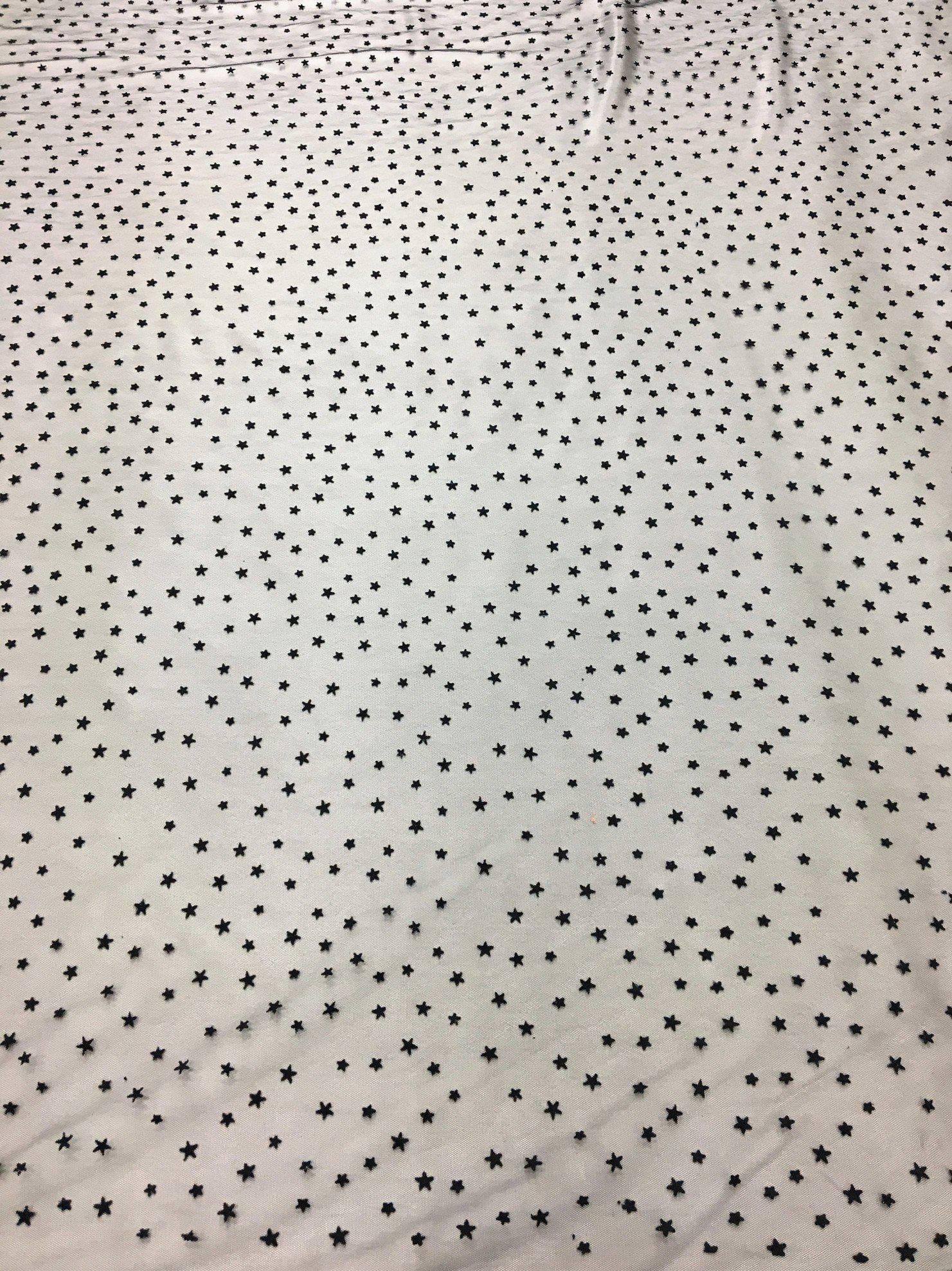 Black Star Tulle — featuring a flocked star design, 100% nylon, 150cm wide