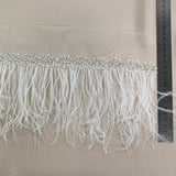 Ostrich feather trim — featuring a soft feather edge with delicate beading, mounted on tulle