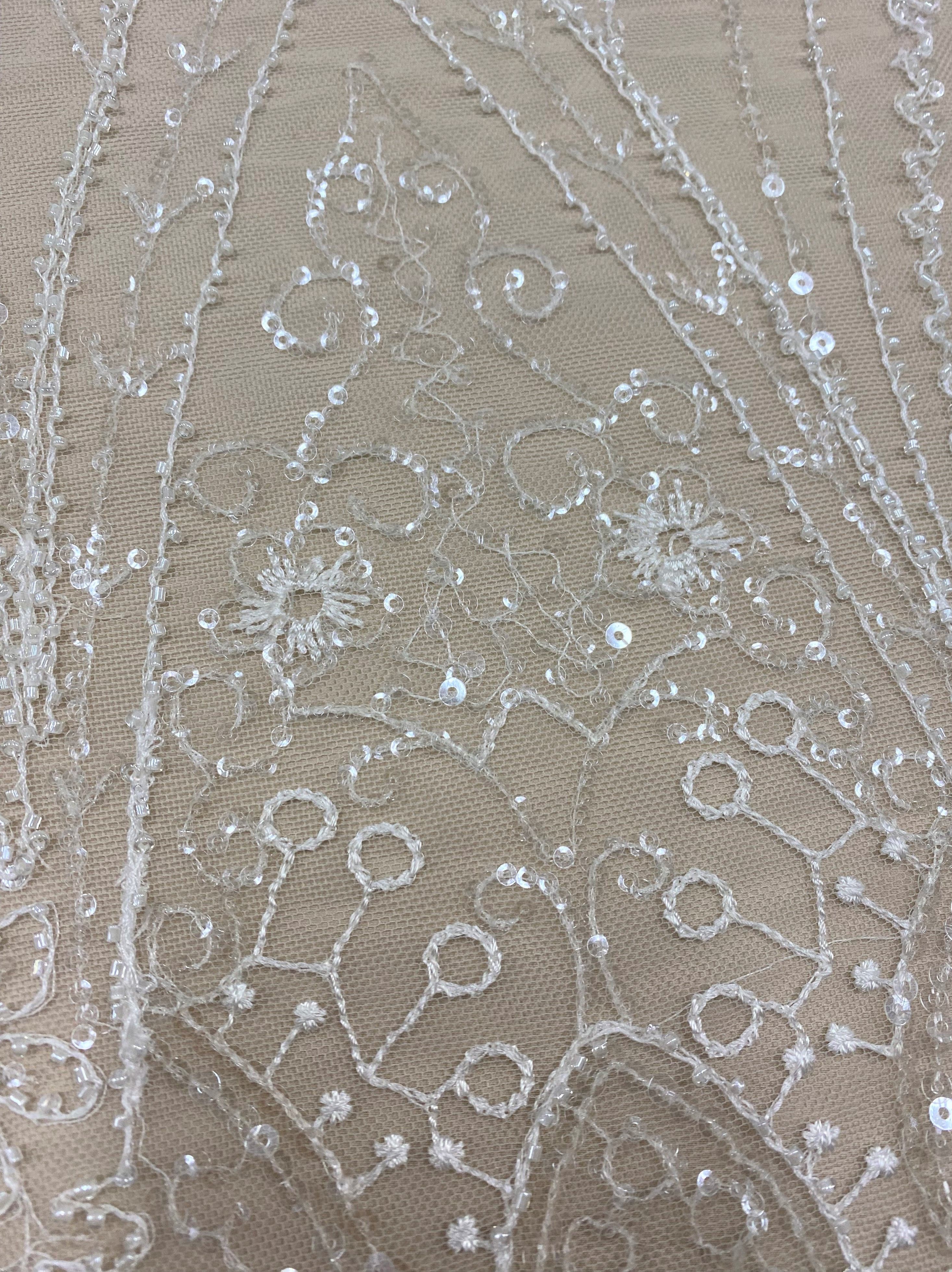 Ivory Embellished Tulle — featuring hand-beading and sequins, 50% nylon 50% rayon, 135cm wide