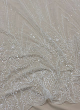 Ivory Embellished Tulle — featuring hand-beading and sequins, 50% nylon 50% rayon, 135cm wide