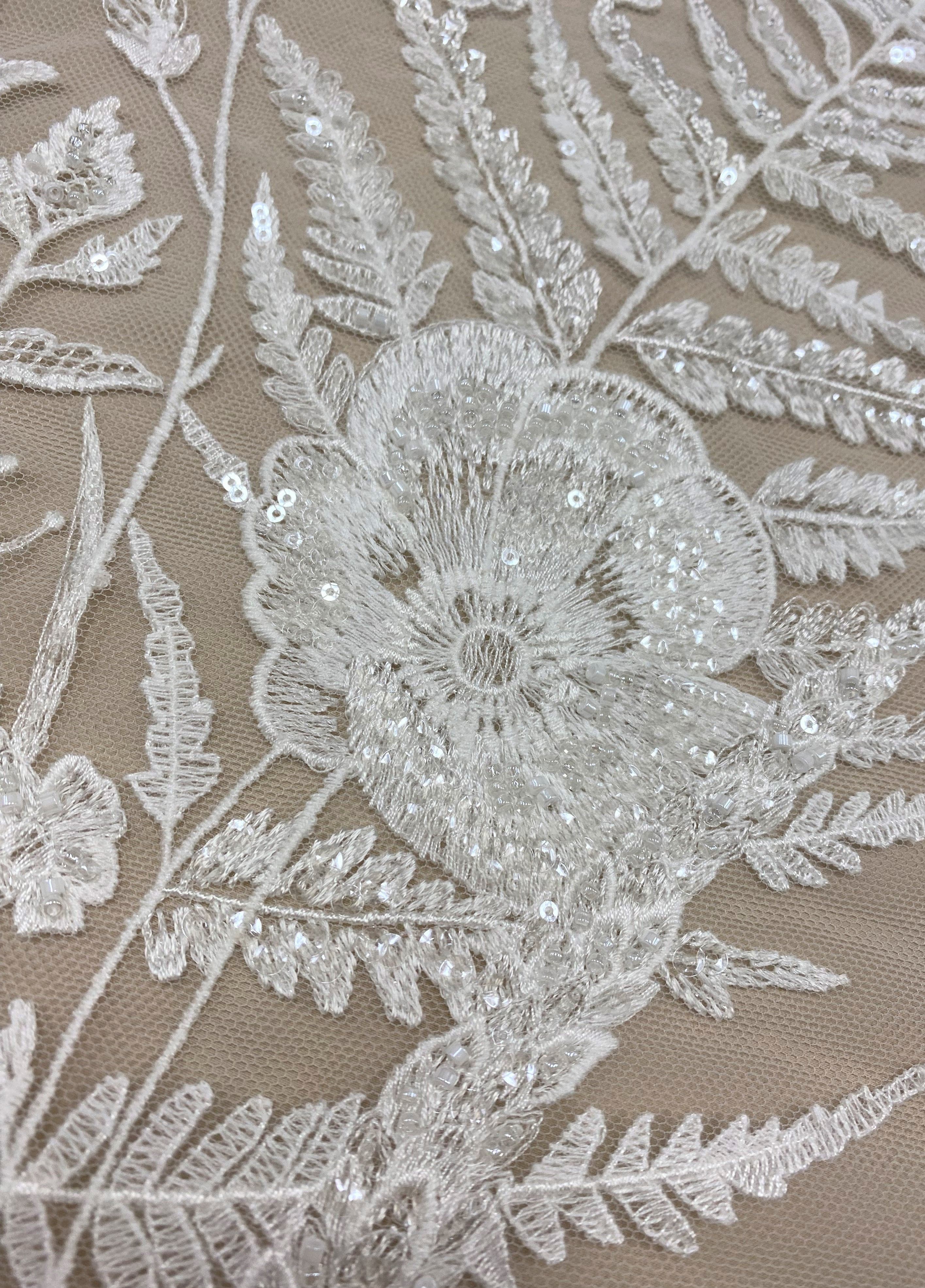 Ivory Embroidered Floral Tulle — featuring floral motifs, hand-beading and sequins, 50% nylon 30% polyester 20% rayon, 130cm wide
