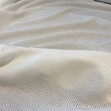 Ivory Recycled Waffle Knit — a soft waffle-textured knit in recycled polyester