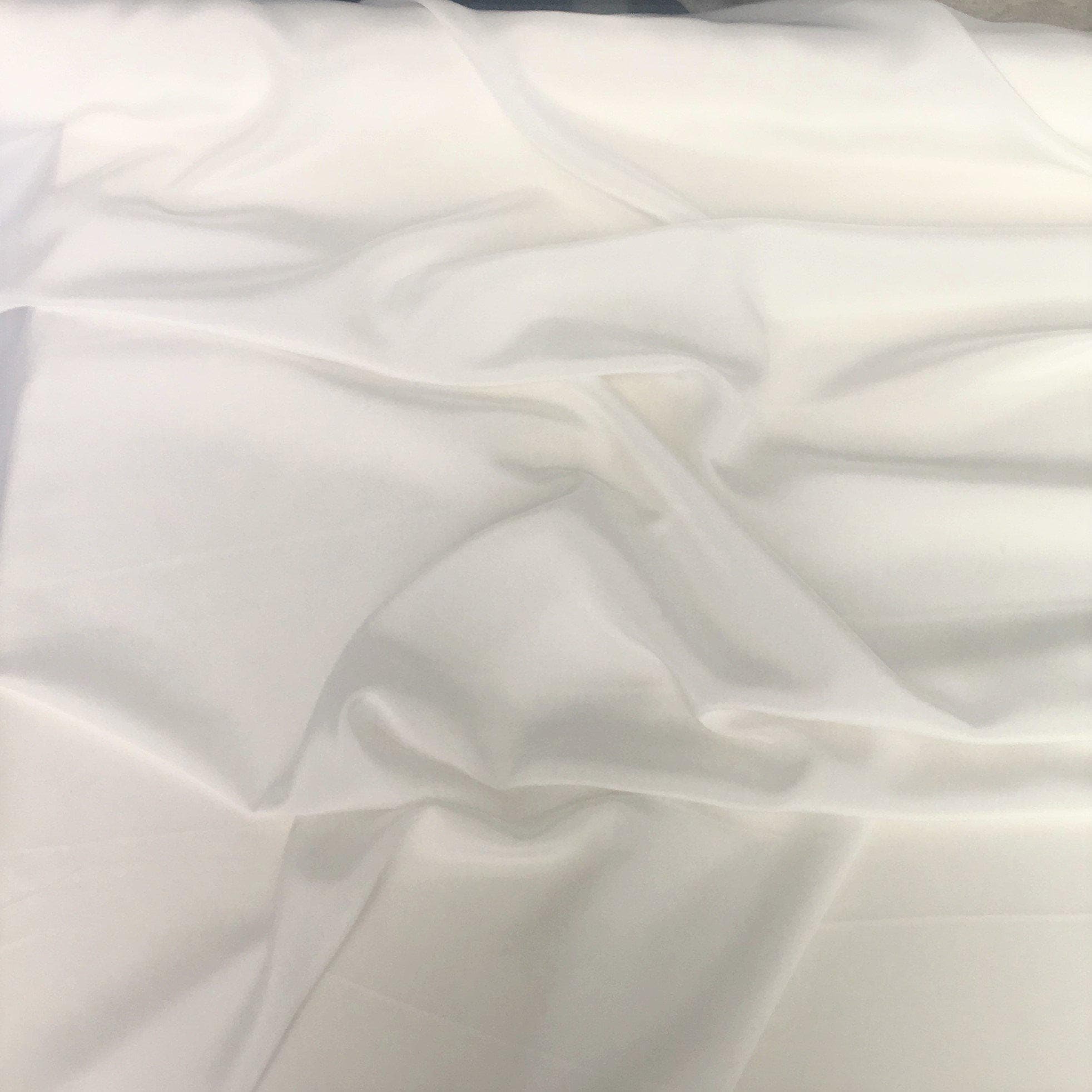 White Crepe De Chine — lightweight with a low-sheen matte finish and a soft, fluid drape, 100% mulberry silk, 137cm wide