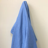 Cornflower Linen — mid-weight plain-weave linen with a slightly crisp handle that softens with wear, 100% linen, 135cm wide