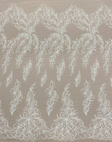 Ivory Embroidered Tulle — featuring a leaf design and hand-beading, 30% nylon 30% rayon 40% polyester, 130cm wide
