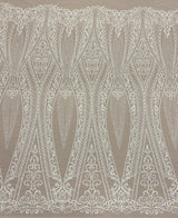 Ivory Embroidered Tulle — featuring scalloped edges and sequins, 30% nylon 30% rayon 40% polyester, 130cm wide