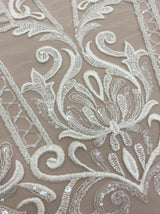 Ivory Embroidered Tulle — featuring scalloped edges and sequins, 30% nylon 30% rayon 40% polyester, 130cm wide