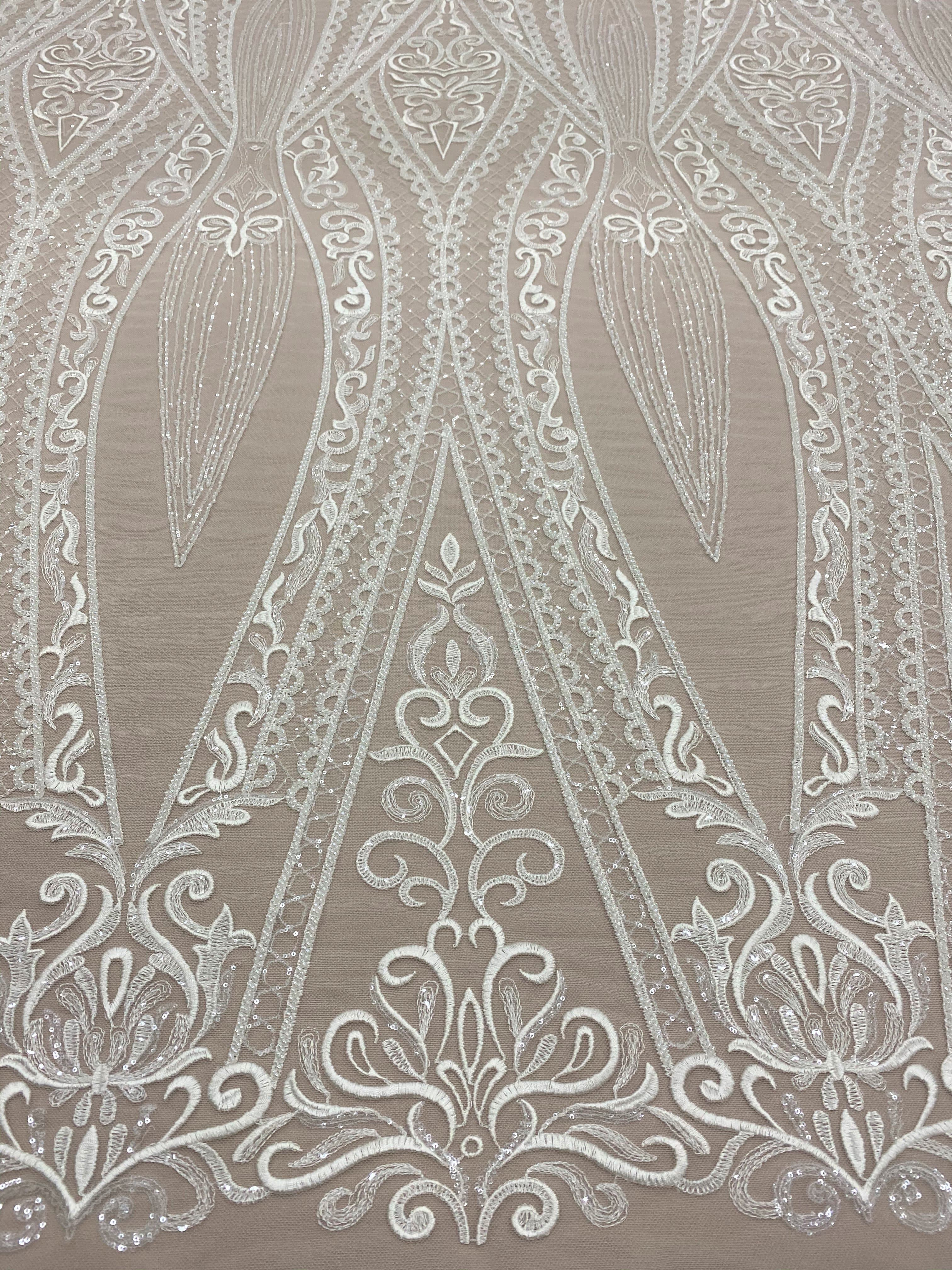 Ivory Embroidered Tulle — featuring scalloped edges and sequins, 30% nylon 30% rayon 40% polyester, 130cm wide