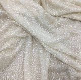 Ivory Sequin Georgette — heavily sequined on a 100% silk georgette base, with sequins running the length, 110cm wide