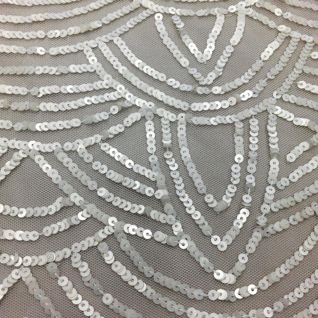 Ivory Scallop Sequin Tulle — featuring scalloped edges and sequins, 100% nylon, 110cm wide