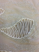 Ivory Hand Beaded Tulle — featuring a corded texture and hand-beading, 100% nylon, 110cm wide