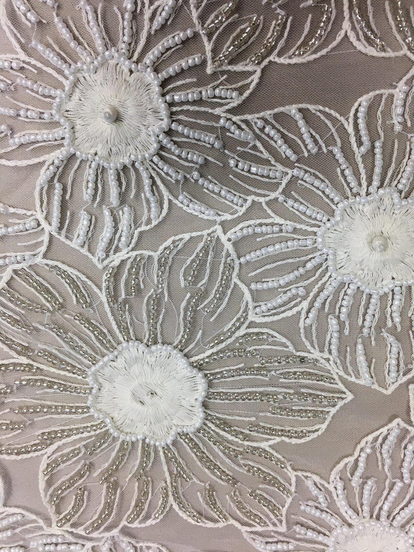 Ivory Floral Beaded Tulle — featuring floral motifs and hand-beading, 100% nylon, 105cm wide