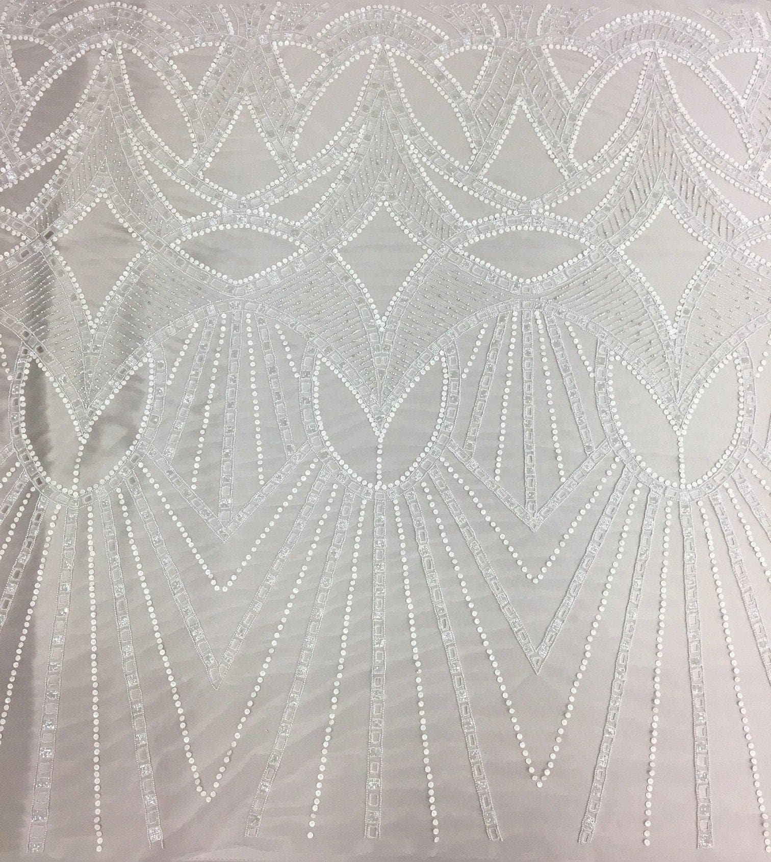 Ivory Cutwork Beaded Tulle — featuring hand-beading and sequins, 100% nylon, 140cm wide