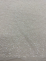 Ivory Beaded Tulle — featuring hand-beading and sequins, 100% nylon, 110cm wide