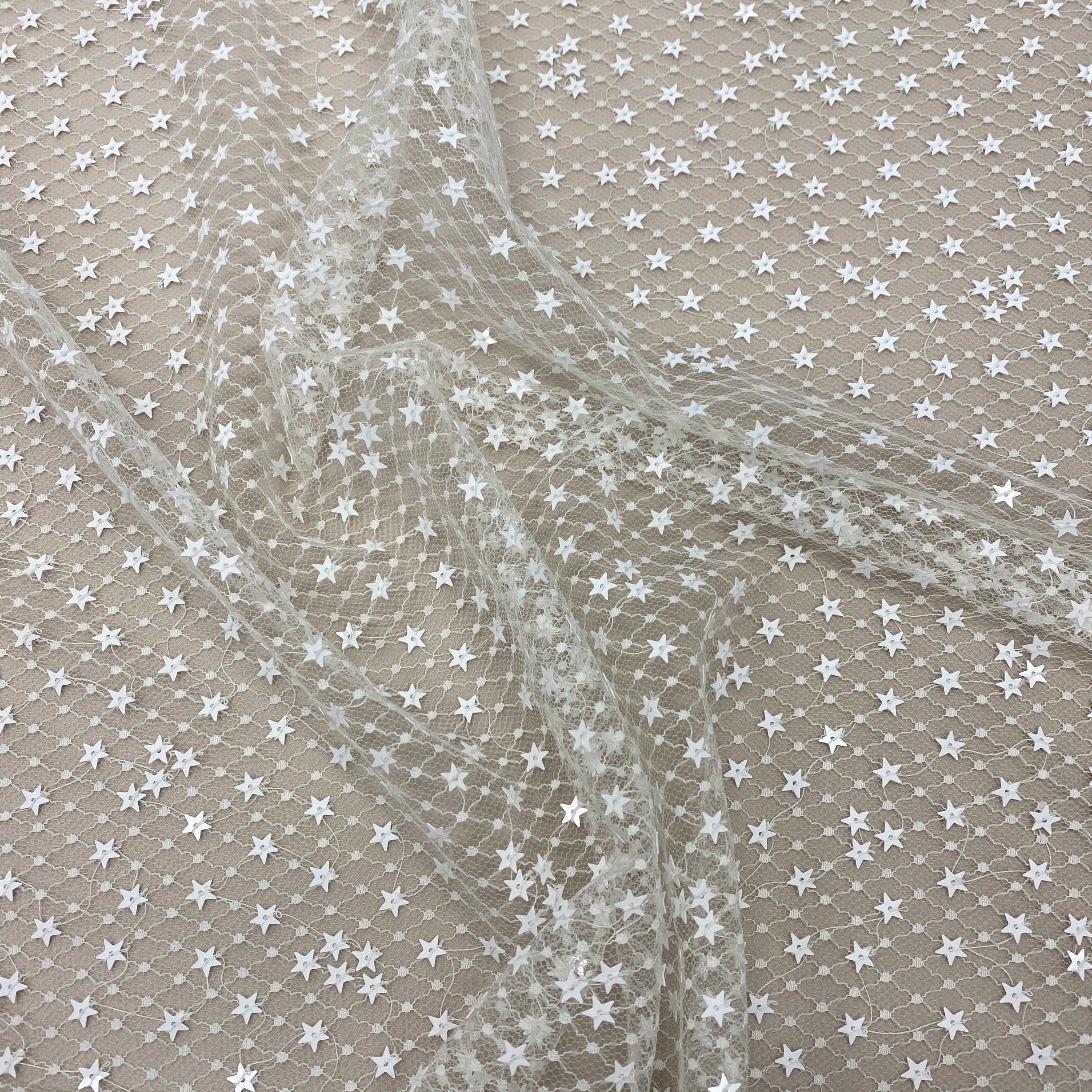 Ivory Sequin Star Tulle — featuring sequins, 100% polyamide, 130cm wide