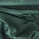 Bottle Green Linen — mid-weight plain-weave linen with a slightly crisp handle that softens with wear, 100% linen, 135cm wide