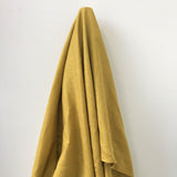 Mustard Linen — mid-weight plain-weave linen with a slightly crisp handle that softens with wear, 100% linen, 135cm wide