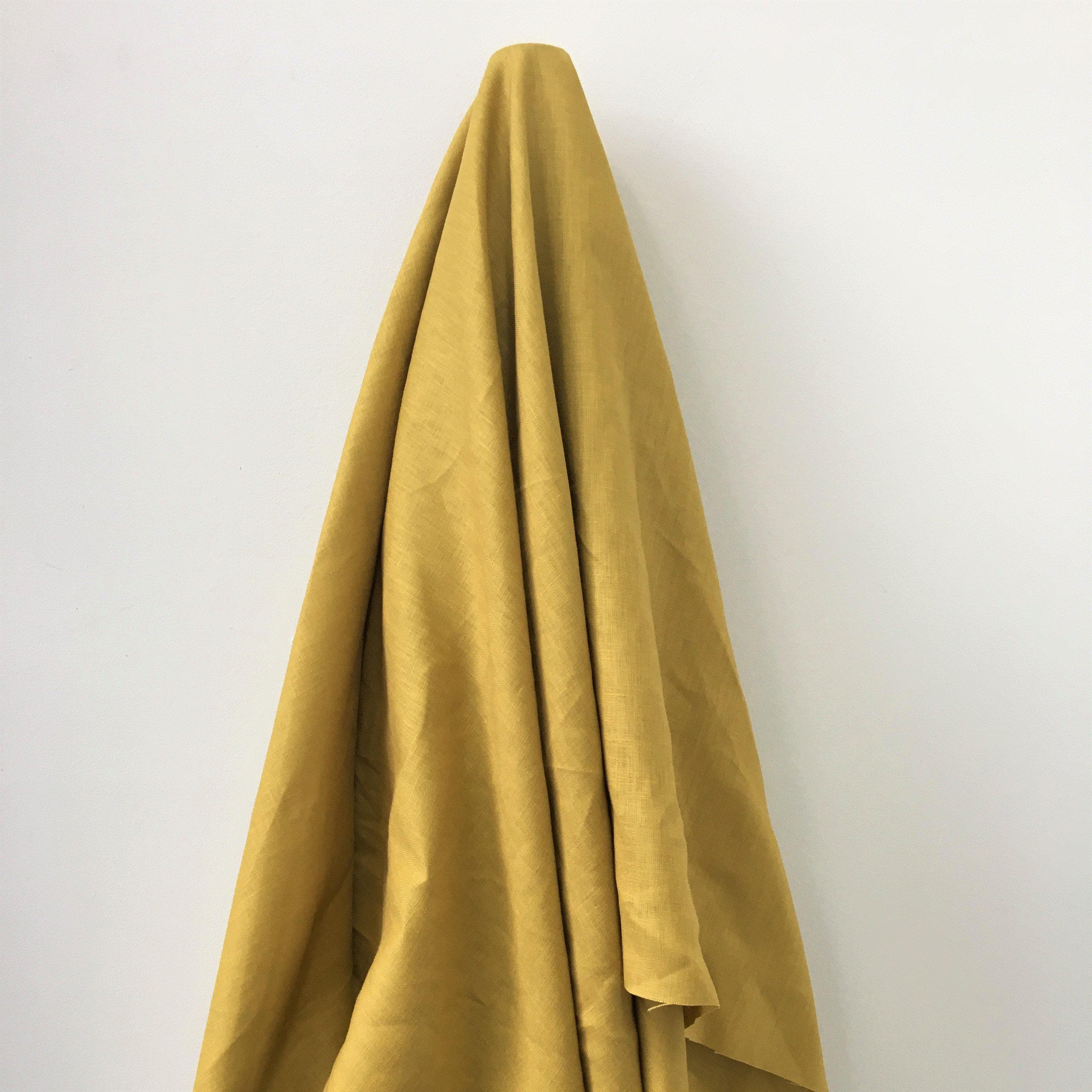 Mustard Linen — mid-weight plain-weave linen with a slightly crisp handle that softens with wear, 100% linen, 135cm wide