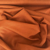 Terracotta Linen — mid-weight plain-weave linen with a slightly crisp handle that softens with wear, 100% linen, 135cm wide