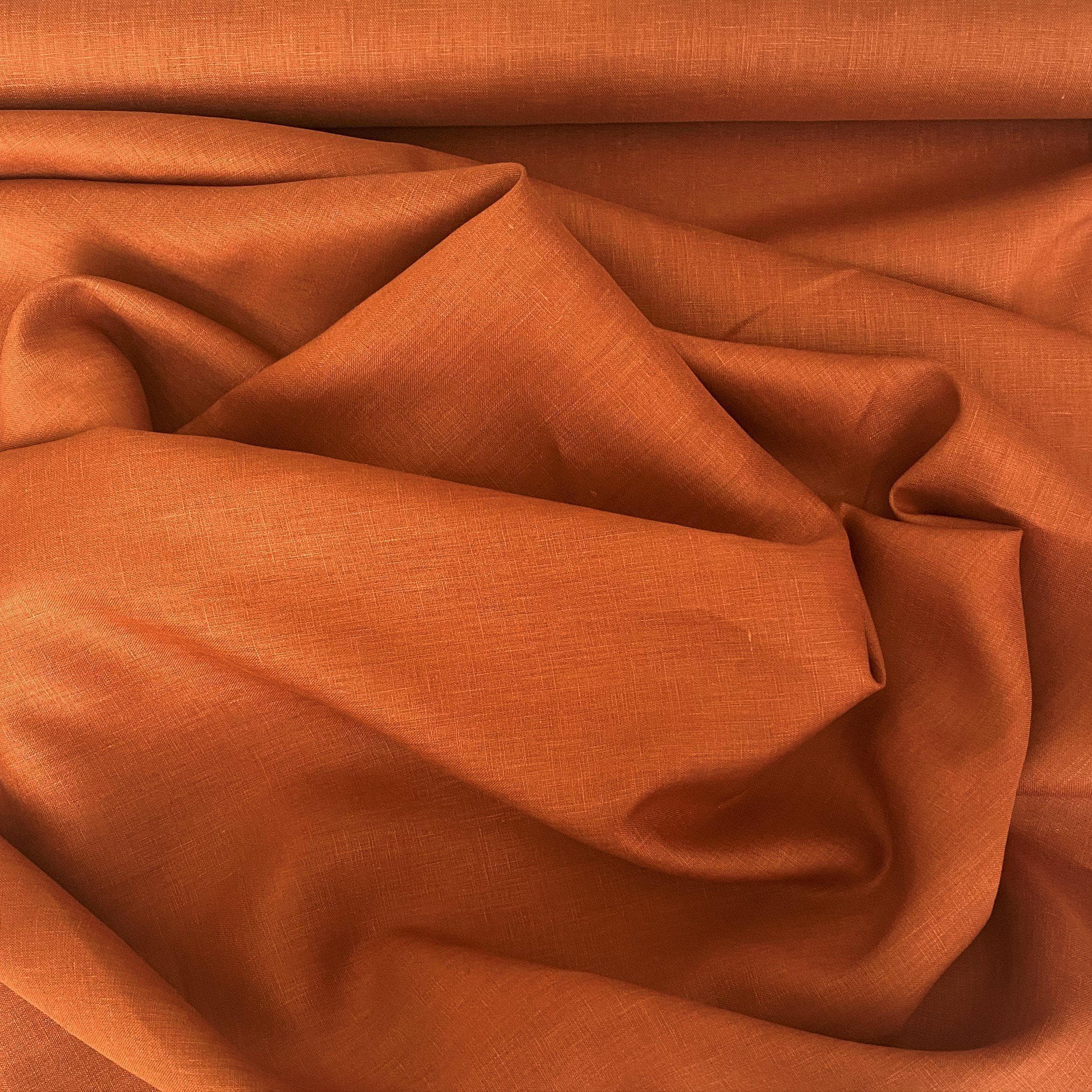 Terracotta Linen — mid-weight plain-weave linen with a slightly crisp handle that softens with wear, 100% linen, 135cm wide