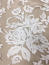 Ivory Floral Embroidered Tulle — featuring scalloped edges and floral motifs, 50% nylon 50% rayon, 130cm wide