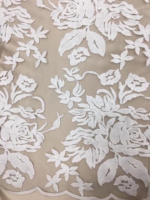 Ivory Floral Embroidered Tulle — featuring scalloped edges and floral motifs, 50% nylon 50% rayon, 130cm wide