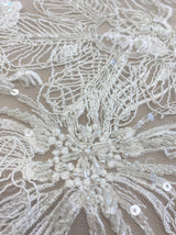 Ivory Embroidered Corded Tulle — featuring floral motifs, a corded texture and hand-beading, 50% nylon 50% rayon, 130cm wide