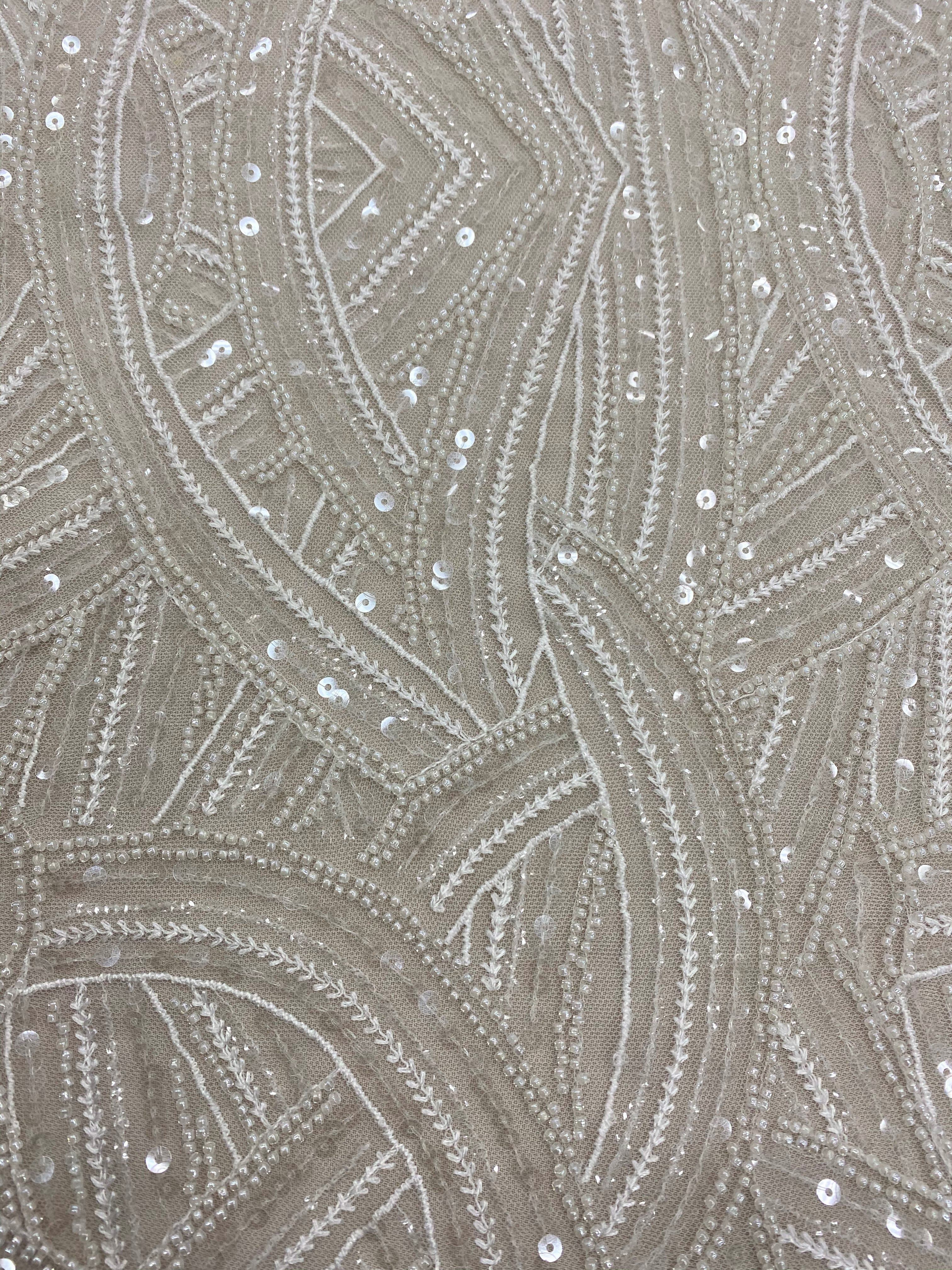 Ivory Embellished Tulle — featuring scalloped edges, hand-beading and sequins, 50% rayon 50% nylon, 130cm wide