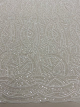Ivory Embellished Tulle — featuring scalloped edges, hand-beading and sequins, 50% rayon 50% nylon, 130cm wide
