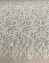 Ivory Embroidered Tulle — featuring scalloped edges, hand-beading and sequins, 50% nylon 50% rayon, 130cm wide